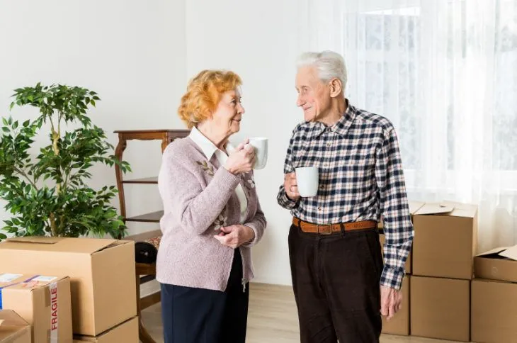 Happy elderly couple after move Happy elderly couple after move
